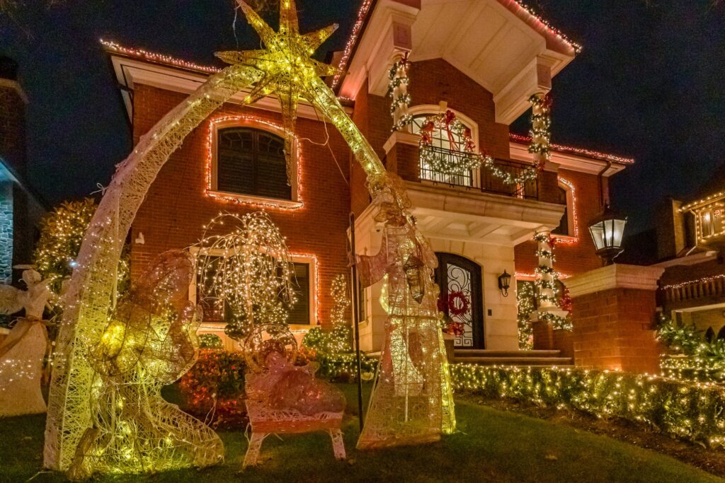 Glowing House With Christmas Lights And Trees