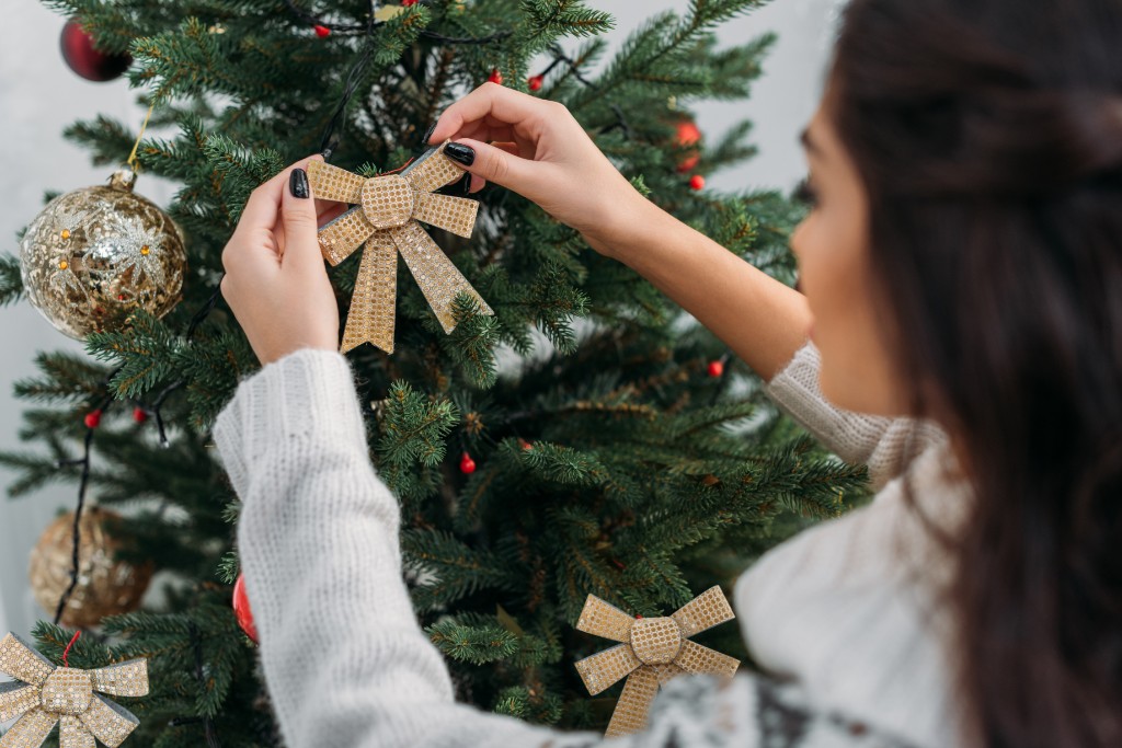 Girl Decorating Christmas Tree