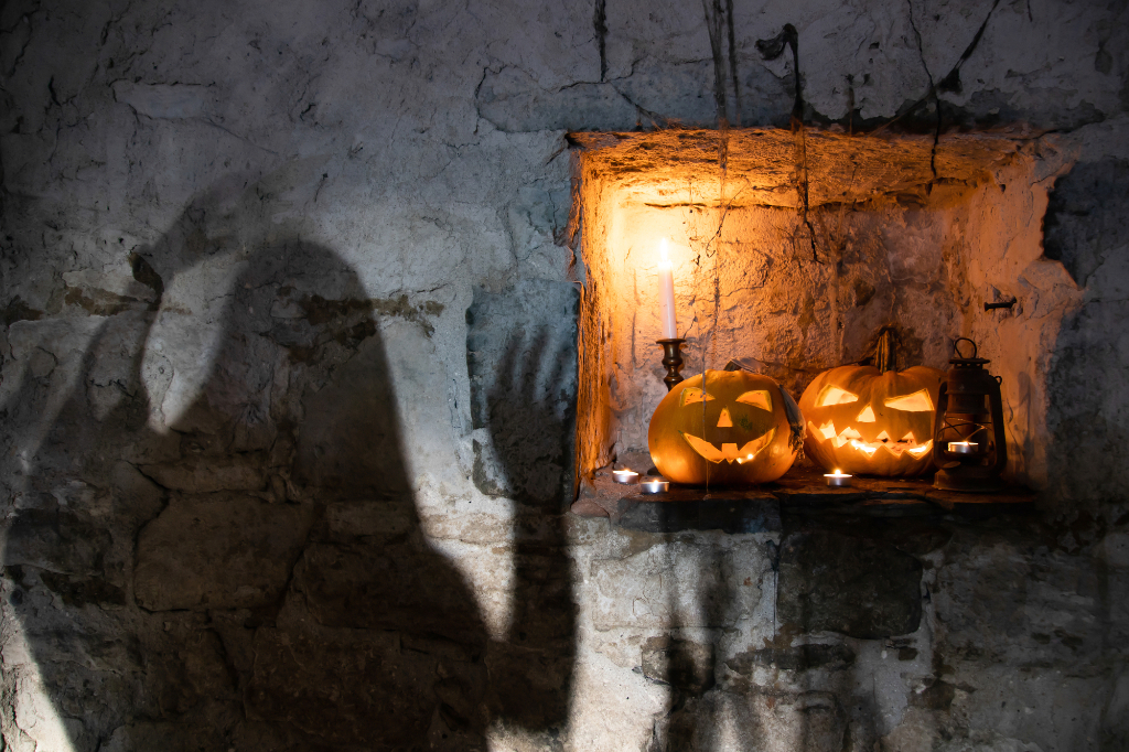 Scary shadow on wall with some helloween pumpkin